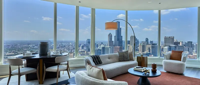 Curved corner living room looking south over the Chicago skyline